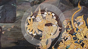 Ancient mural painting with scene from the Ramakien at Wat Phra Kaew Temple photo