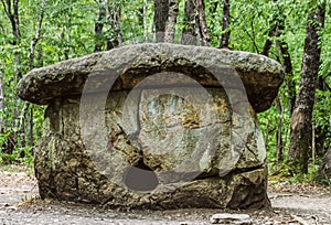 Ancient mysterious megalithic dolmen in the forest