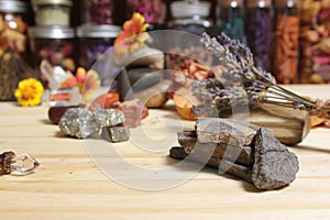 Ancient Native American Pottery Pieces With Crystals and Flowers on Meditation Table