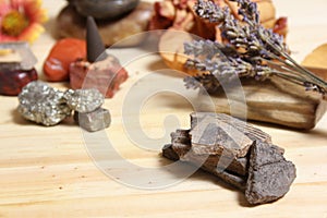 Ancient Native American Pottery Pieces With Crystals and Flowers on Meditation Table