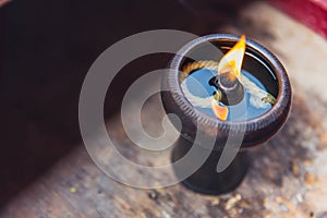 Ancient oil lamp in Thai Temple