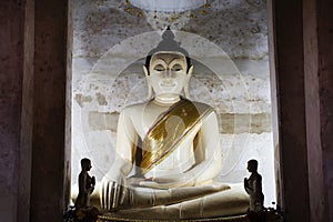 Ancient old buddha in antique ruin ubosot of Wat Mae Nang Pleum or Maenangpluem Temple for thai people travelers visit respect