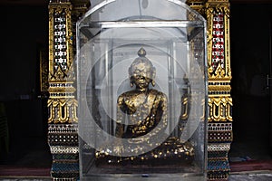 Ancient old buddha in antique ruin ubosot of Wat Yai Chom Prasat temple for thai people travelers travel visit and respect praying