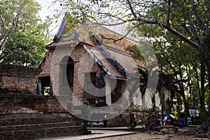 Ancient old ordination hall or antique ruin ubosot for thai travelers people travel visit respect praying blessing buddha wish