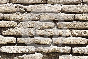 An ancient old rough drystone wall. Background photo. Texture pattern.