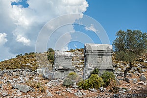 Ancient old ruined tombs against cloudy sky in Turkey