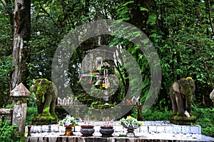 Ancient old stupa shrine in antique forest jungle for thai people travelers travel visit praying blessing wish worship holy myth