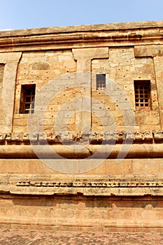 Ancient ornamental dravidian styled wall with windows of the Brihadisvara Temple in Thanjavur, india.