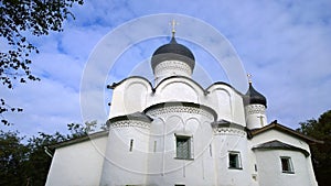 Ancient orthodox christian stone temple. Pskov, Russia. Church of St. Basil the Great on the Hill on background blue sky. 15th cen