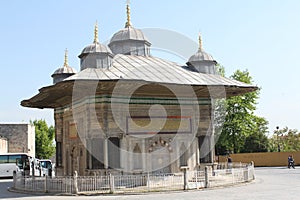 Ancient Ottoman Fountain of Sultan Ahmed II, in square. Turkish Rococo style in Istanbul, Turkey