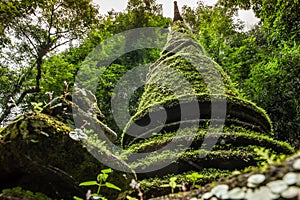 Ancient pagoda and beautiful moss, Alongkorn Chedi Pagoda located in tropical forest of Namtok Phlio National Park, Chanthaburi,