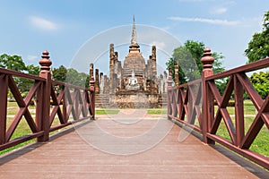 Ancient pagoda and big buddha at Sukhothai Historical Park.