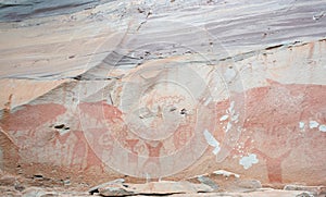 Ancient paintings, about 3000-4000 years old, on a stone wall.