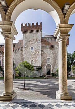 The ancient Palazzo Cybo Malaspina or Palazzo Ducale, in the historic center of Carrara, Italy, framed between two columns