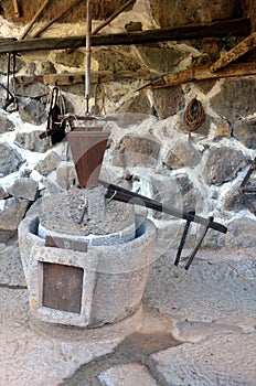 The ancient part of the oil press millstone ancient olive oil production machinery, stone mill and mechanical press is found in cl