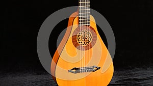 Ancient pear guitar manufactured by a luthier gyrating