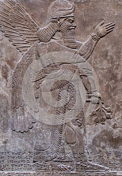 Ancient persian bas-relief depicting a winged god