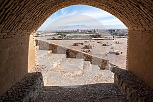 Ancient persian city of Yazd, Iran, viewed from a tomb on a hill of a tower of silence. Hot summer day in the capital of