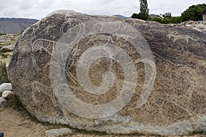 Ancient petroglyph located in Cholpon Ata, Issyk-Kul, Kyrgyzstan photo