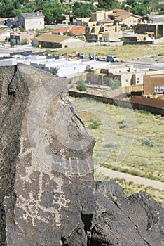 Ancient petroglyph and suburbs, Albuquerque, NM