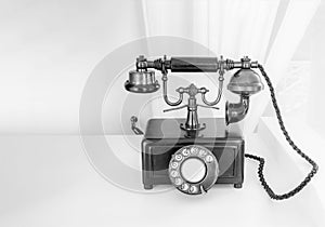 Ancient phone is placed on a wooden table