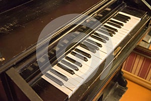Ancient piano with white and black keys