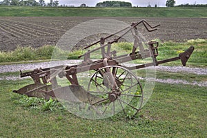 Ancient plough on the grass photo