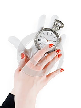 Ancient pocket watch in woman hands