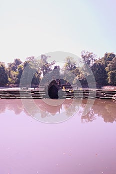 Ancient pool. The pool, the shore and the bottom of which are laid out of stone blocks. Neak Pean. Khmer baray