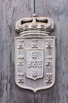 Ancient Portuguese coat of arms with crown, towers and shields