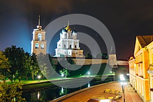 Ancient Pskov Kremlin on river bank, Trinity church, night time