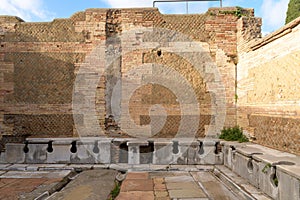 Ancient public toulet in Ostia Antica - ancient roman city and port