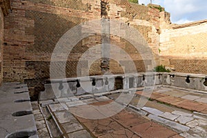 Ancient public toulet in Ostia Antica - ancient roman city and port