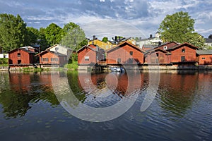 Ancient red barns on the banks. Porvoo, Finland photo