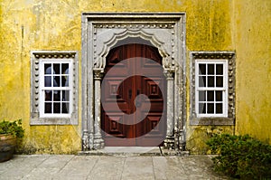 Ancient red door in Quinta da Regaleira, Sintra, Portugal photo