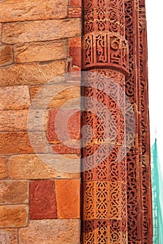 Ancient red sandstone minaret old architecture Columns with stone carving in courtyard