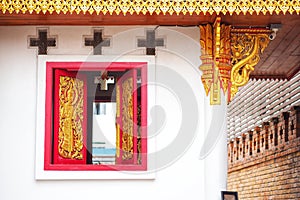 Ancient Red window of Thai temple.
