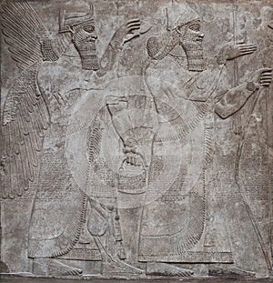 Ancient relief of assyrian gods