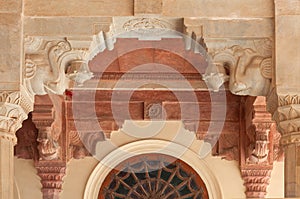 Ancient relief with Elephants heads at column at famous Amber fort near Jaipur, Rajasthan, India