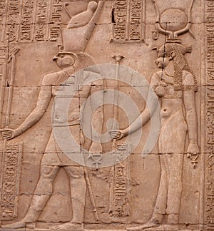 Ancient relief with Horus God and Hathor Goddess of Kom Ombo temple in Aswan Governorate, Upper Egypt. It was constructed during