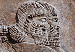 Ancient relief of two assyrian warriors