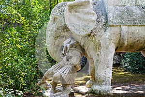 Ancient renaissance sculpture War Elephant and Roman Soldier in the famous Parco dei Mostri, also called Sacro Bosco or Giardini d