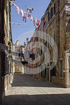 Ancient road in Venice with cloths hang out to dry