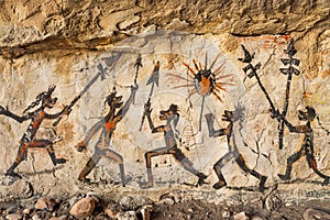 Ancient rock art depicting tribal dance and rituals