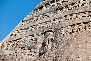 Ancient rock carvings of Jain tirthankaras on a hill photo