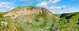 Ancient rock with caves. Wide angle panorama