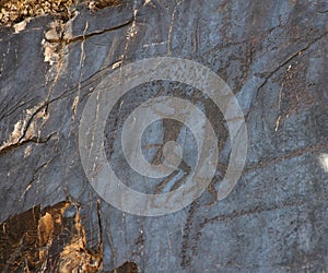 Ancient rock drawings petroglyph, two dancing human