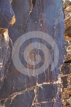 Ancient rock drawings petroglyph, woman and two man