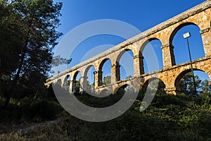 Ancient Roman aqueduct in Tarragona, Spain, sunset