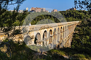 Ancient Roman aqueduct in Tarragona, Spain, sunset